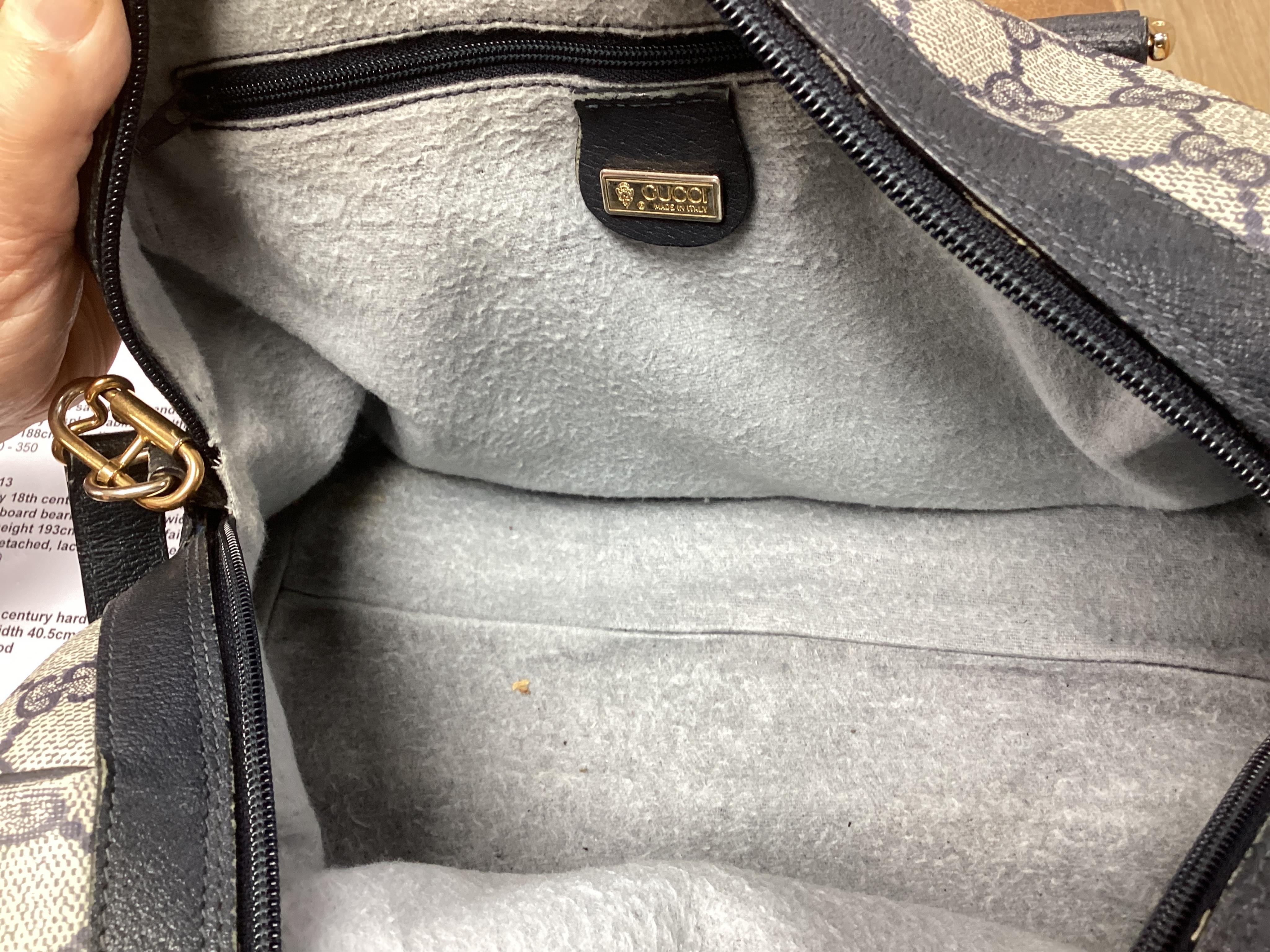 A Gucci monogram blue canvas handbag, wallet and purse